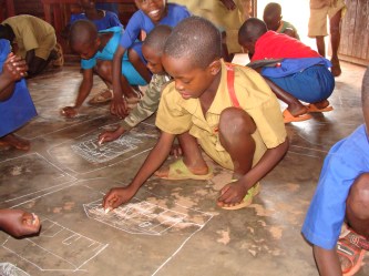 Kids drawing on the floor Kabare June 2010 (6)